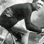 Italian cyclist Giovanni Gebi, the Red Devil is posing on his bicycle in the classical old fashioned style