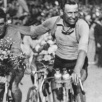 Gustaaf Deloor celebrating his victory alongside his brother Alphonse