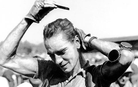 Hugo Koblet's famous signature move of combing his hair nonchalantly after crossing the finish line at the Tour de France in 1951.