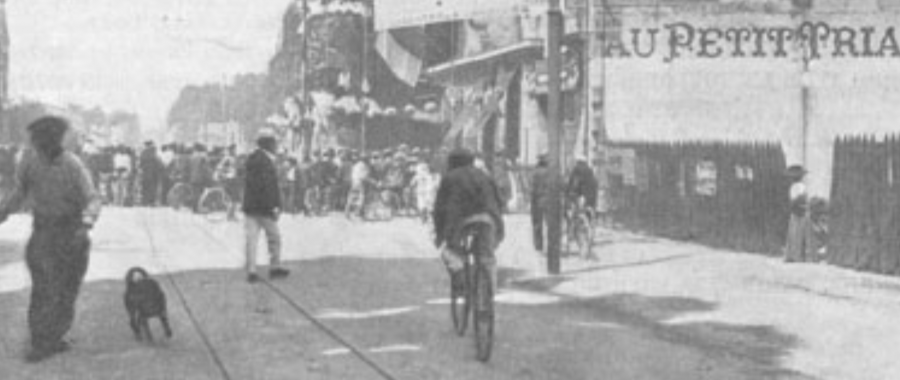 Cyclists arriving in a town during Tor de France 1904