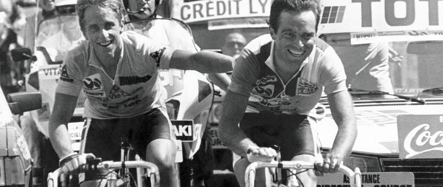 Greg Lemond and Bernard Hinault crossing the finish line in Alpe d'Huez at the Tour de France in 1986