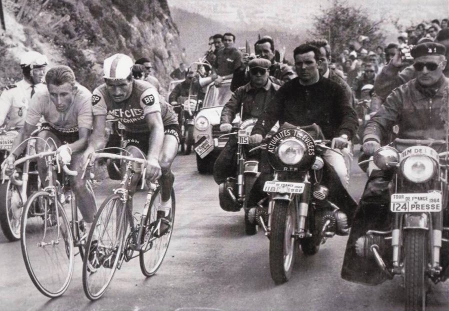 Jacques Anquetil and Raymond Poulidor shoulder to shoulder climbing Piyde Dôme in the 20th stage of Tour de France 1964