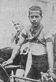 Italian cyclist Olimpio Bizzi posing with his bike 