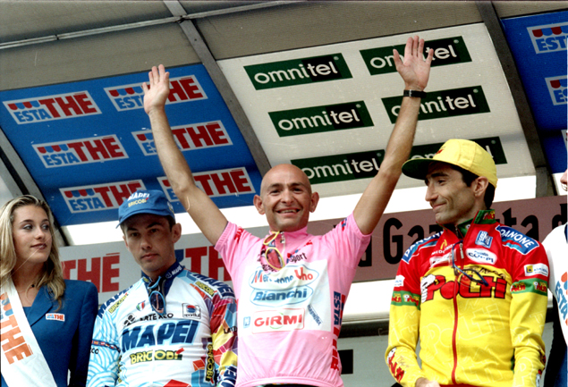 Marco Pantani in pink (maglia rosa) on the top of the podium of Giro d'Italia 1998