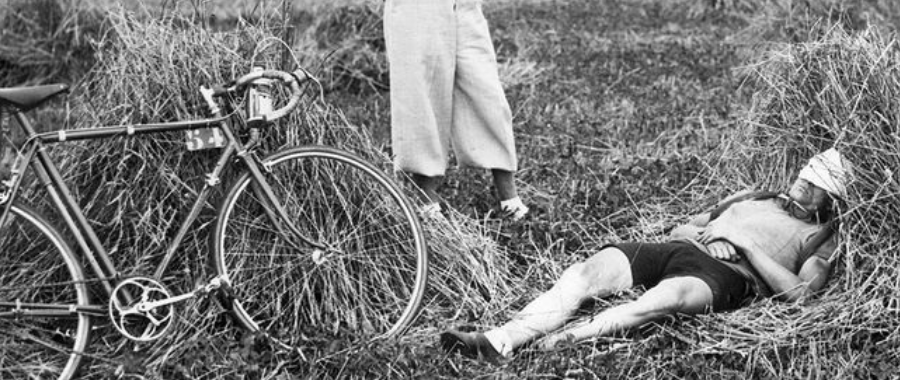 A cyclists is sleeping among hays during Tour de France 1939